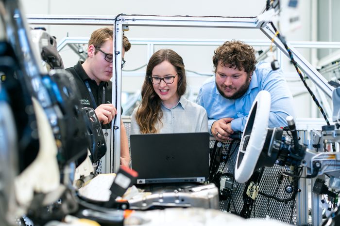 Engineers reviewing equipment data together on the plant floor
