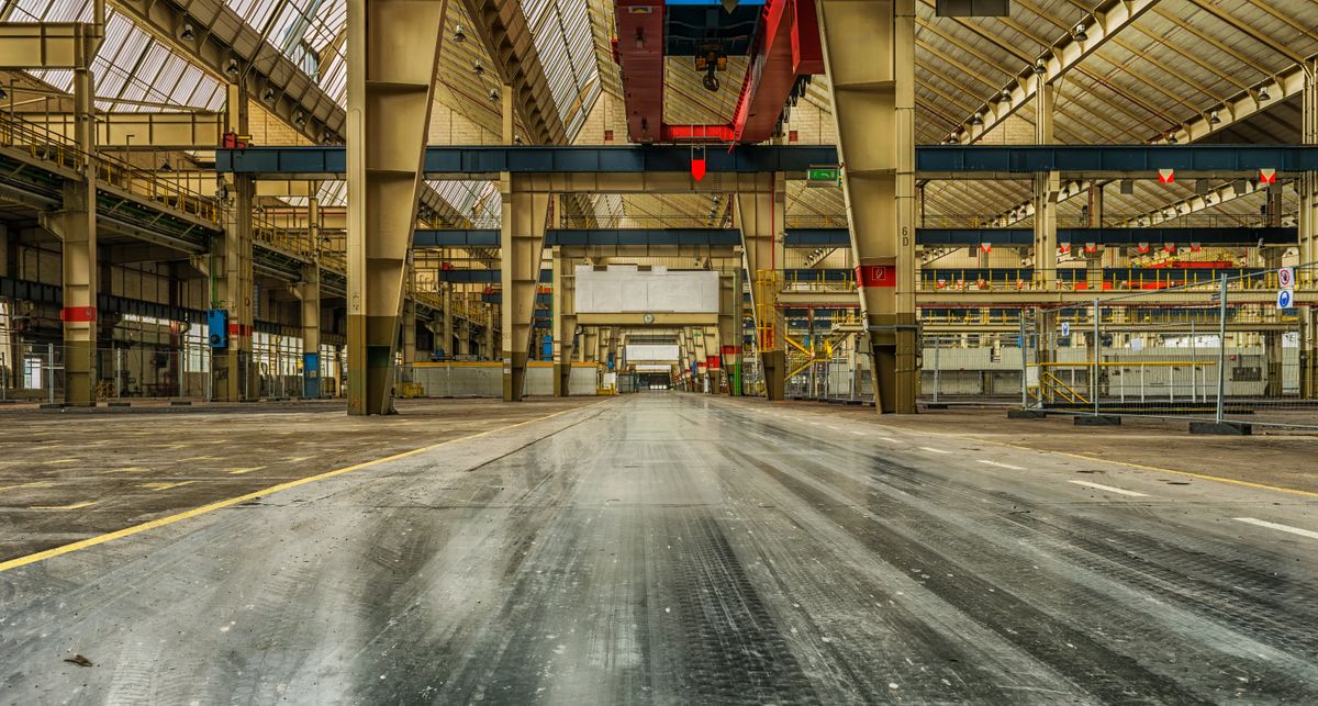An idle industrial facility during a period of investment pause